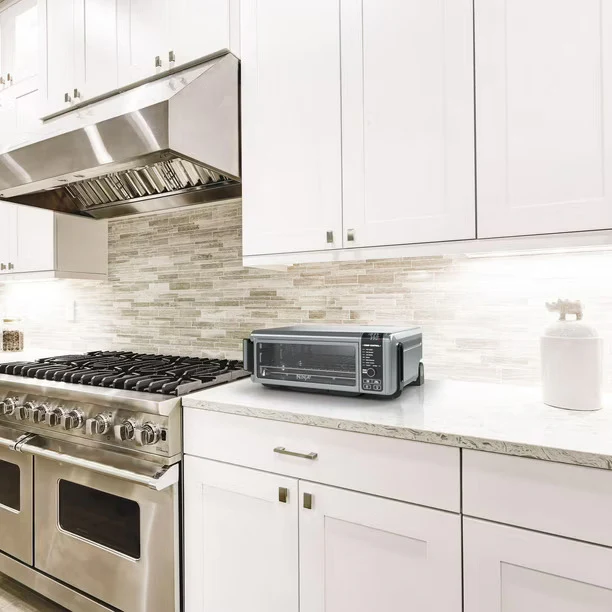 Ninja SP100 Digital Air Fry Countertop Oven with 6-in-1 Functionality, Flip Up & Away Capability for Storage Space, with Air Fry Basket, Wire Rack & Crumb Tray, Silver - Image 4
